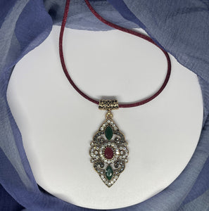 Pendant necklace with burgundy silky rope