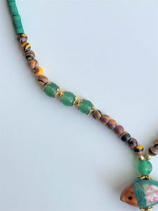 Strand Necklace with mixed material, fish shaped pendant