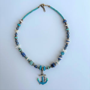 Strand Necklace with mixed material & anchor pendant