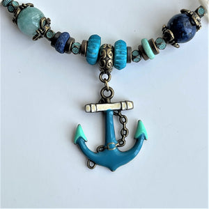 Strand Necklace with mixed material & anchor pendant